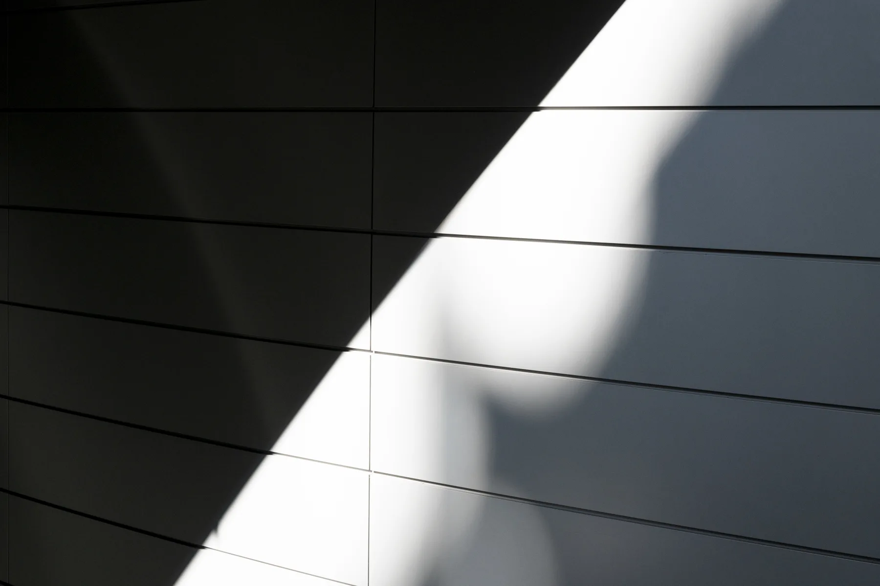 Natural light across a geometric building facade